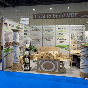 3m x 4m shell scheme using printed rollable graphics or foamex panels. L shaped stand with 7 printed panels. 